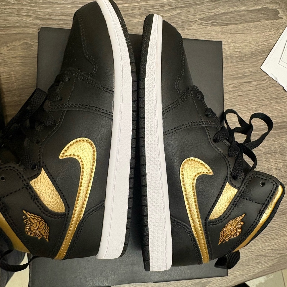 Jordan Black and Gold High-Top Sneakers